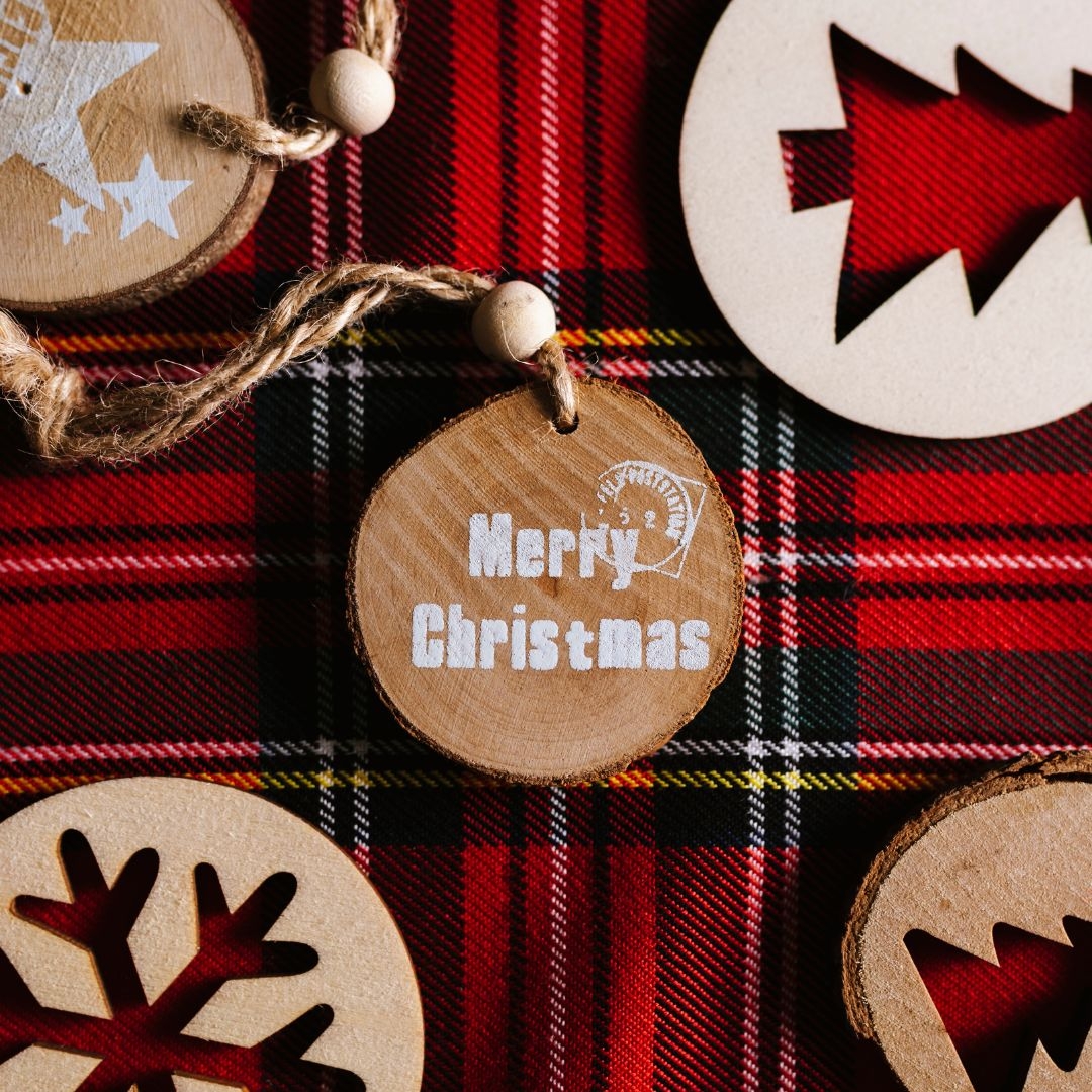 Wooden ornaments on a plaid tablecloth