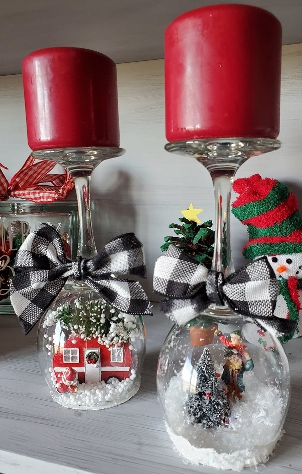 wine glass snow globes with red pillar candles