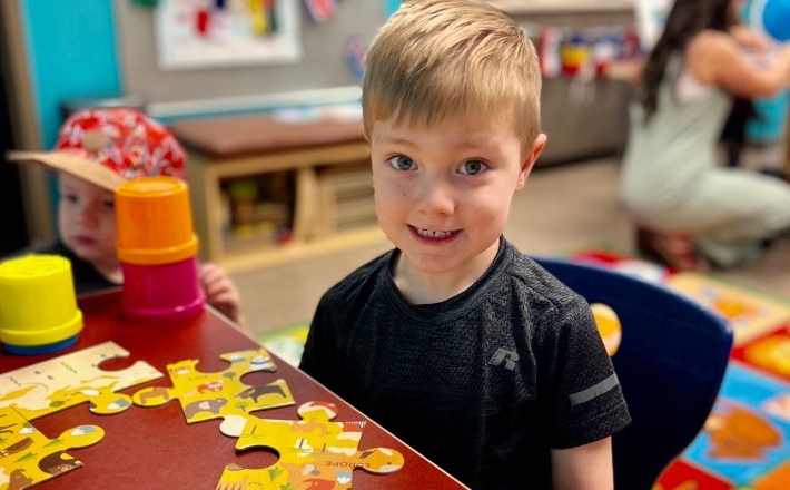 Story Time, boy playing with a puzzle