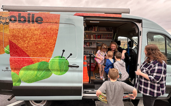 TCPL Stories - Bookmobile with kids visiting for books